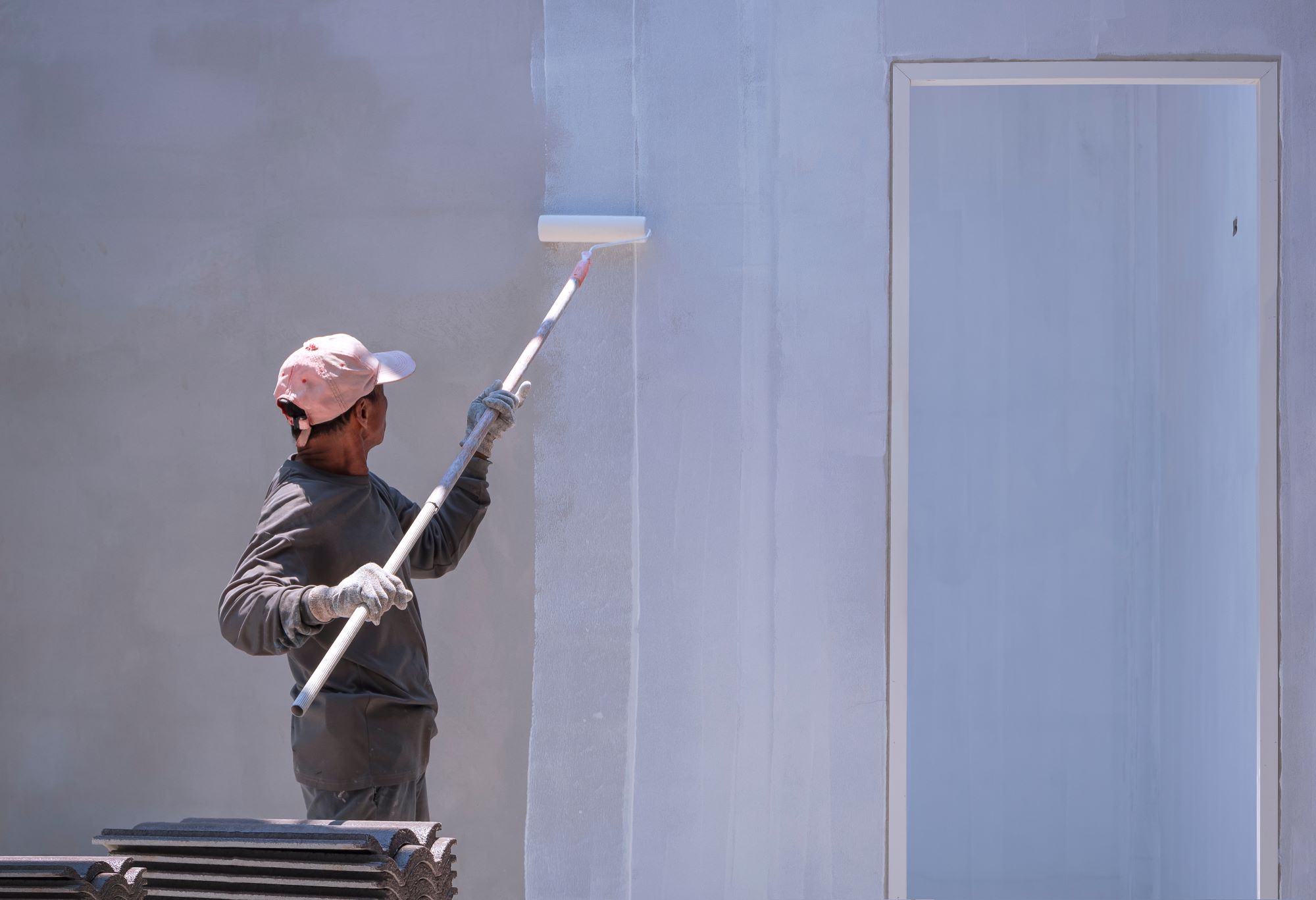 construction worker painting primer white color on 2023 11 27 05 34 52 utc